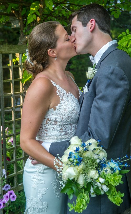 Wedding kiss mile away resteraunt courtyard marmot milford new hampshire wedding venue.  New england wedding photographer